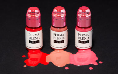 Three Perma Blend LUXE pigments with red and pink color drops.