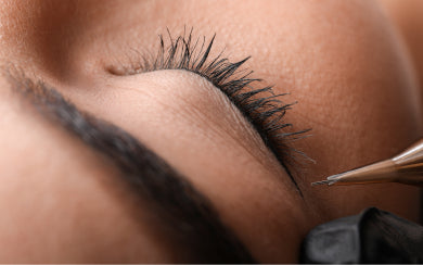 Permanent eyeliner pigment applied along the upper lash line.