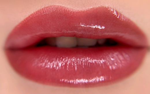 Glossy rosy-pink lip blush PMU result close-up.
